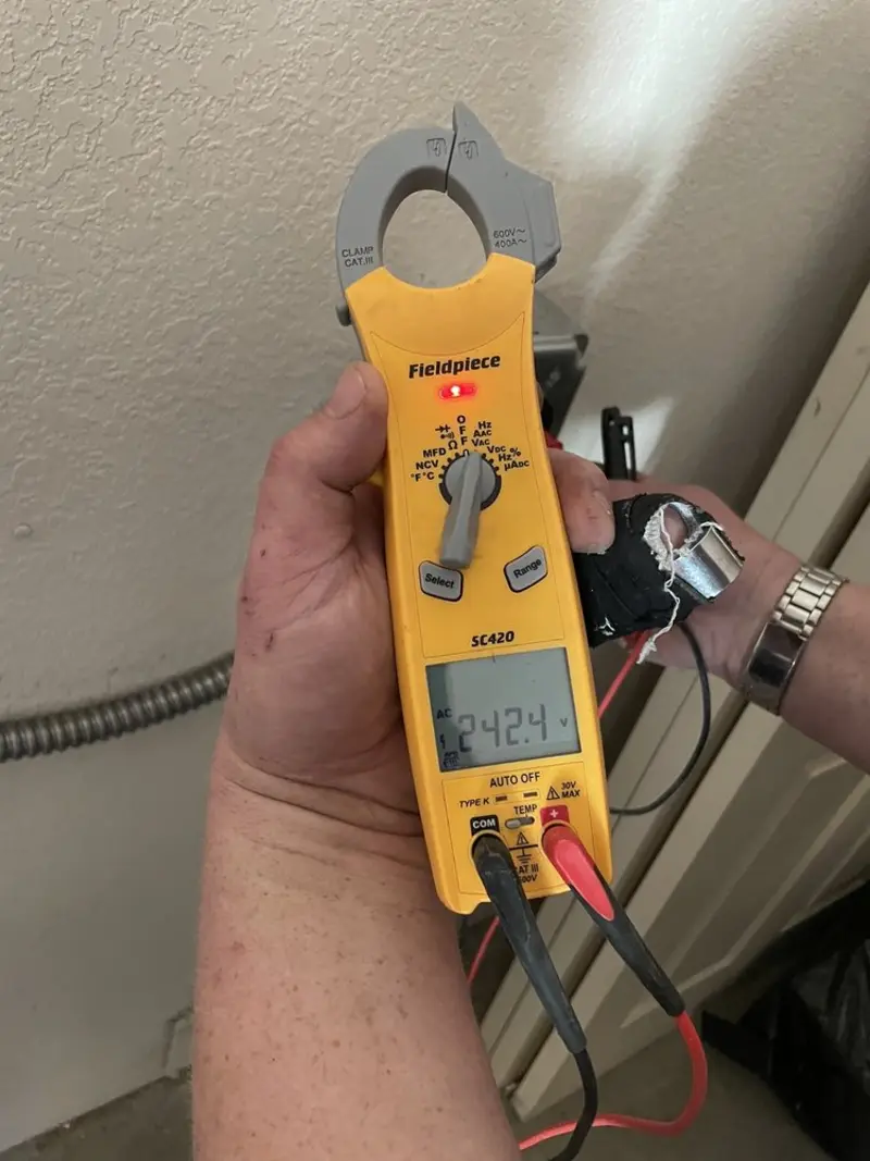 Voltage testing with clamp meter during Electrical Installation Services in Manchester